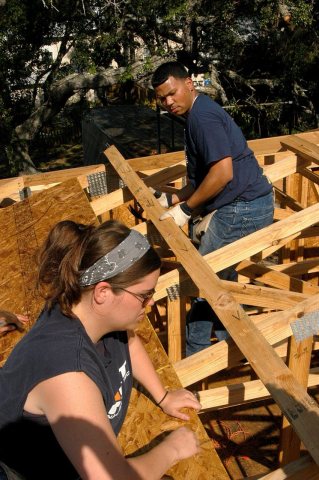US Navy 060519-N-6645H-053 Gunner's Mate 2nd Class Amy Hamilton, left, and Machinist's Mate Fireman Andy Gomez help bui…