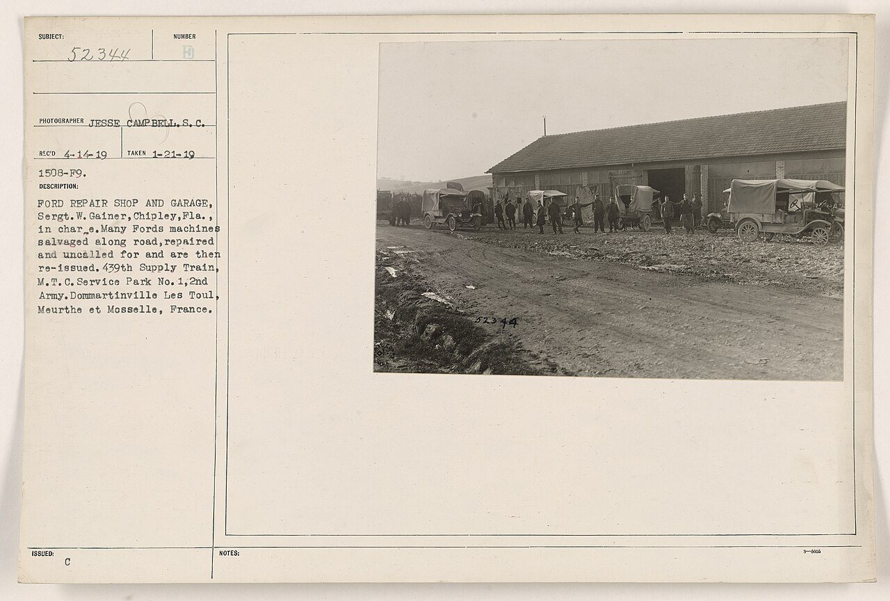Ford Repair Shop and Garage, Sergt. W. Gainer, Chipley, Fla. In charge. Many Ford machines salvaged along road, repaire…