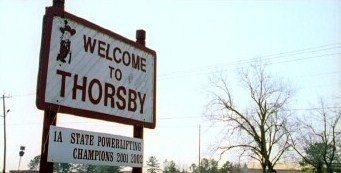 Thorsby town sign displaying Rebel man