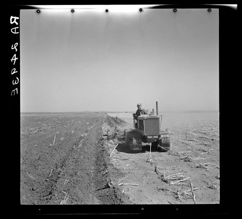 A farmer listing his fields under the wind erosion control program. He receives twenty cents an acre for the work. Libe…