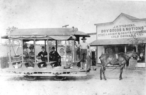 Horse-drawn streetcar in front of J.W. Stephens' store in