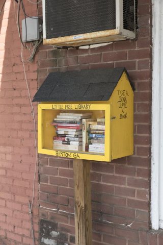 A bird-house, or free take-one, bring-one lending library location