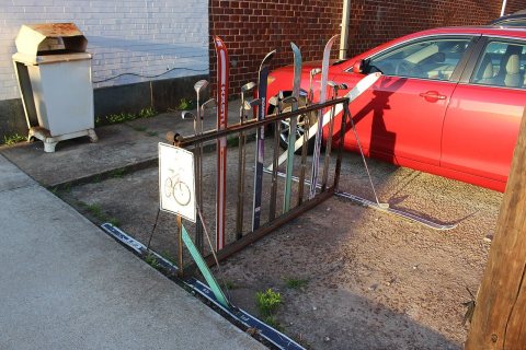 Bicycle Rack made out of skis and golf clubs