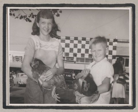 Photograph of 4-H club members posing with chickens at a poultry show, Clarkesville, Habersham County, Georgia, 1950