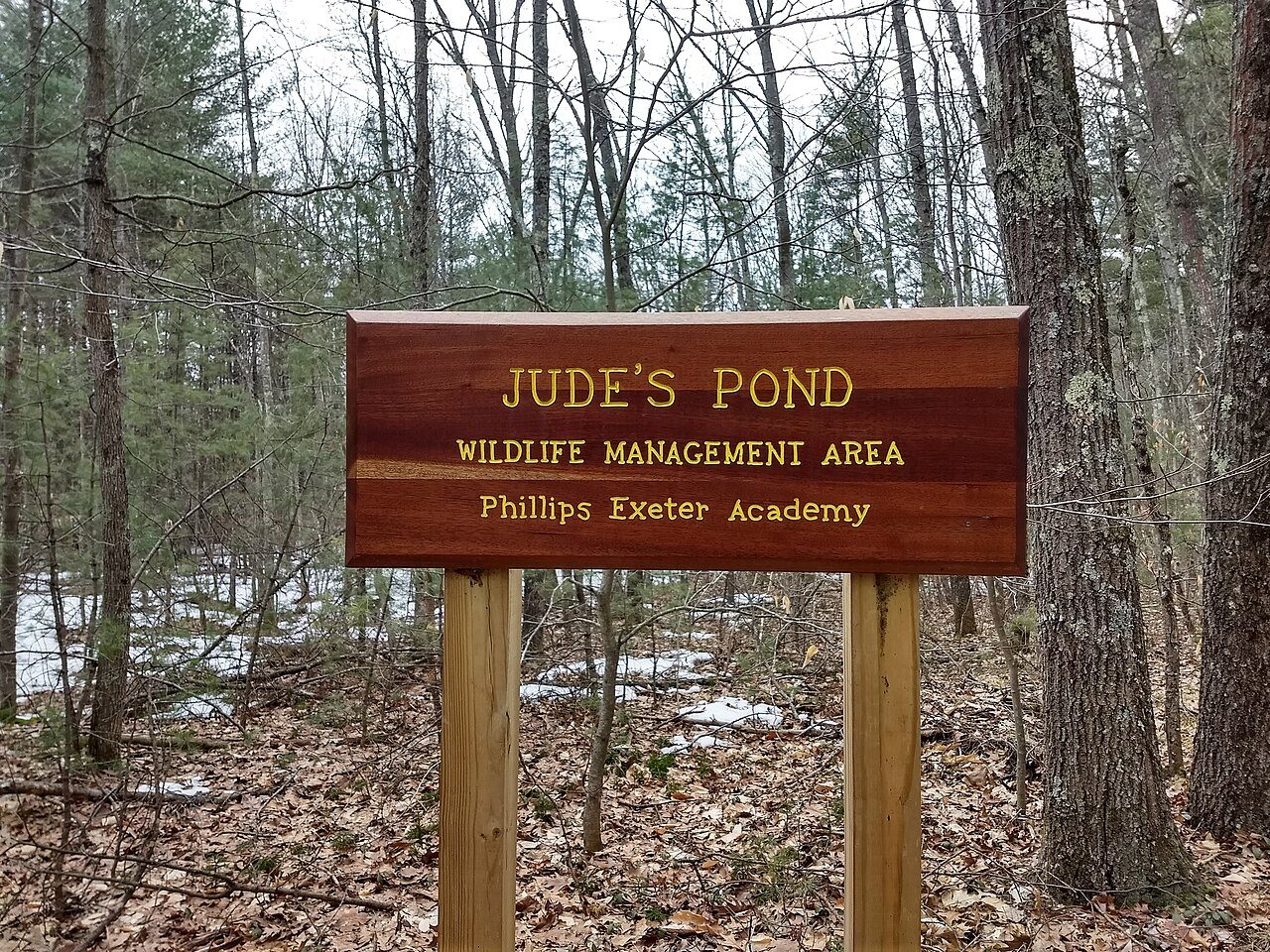 Judes pond sign Exeter NH, near memorial at water's edge