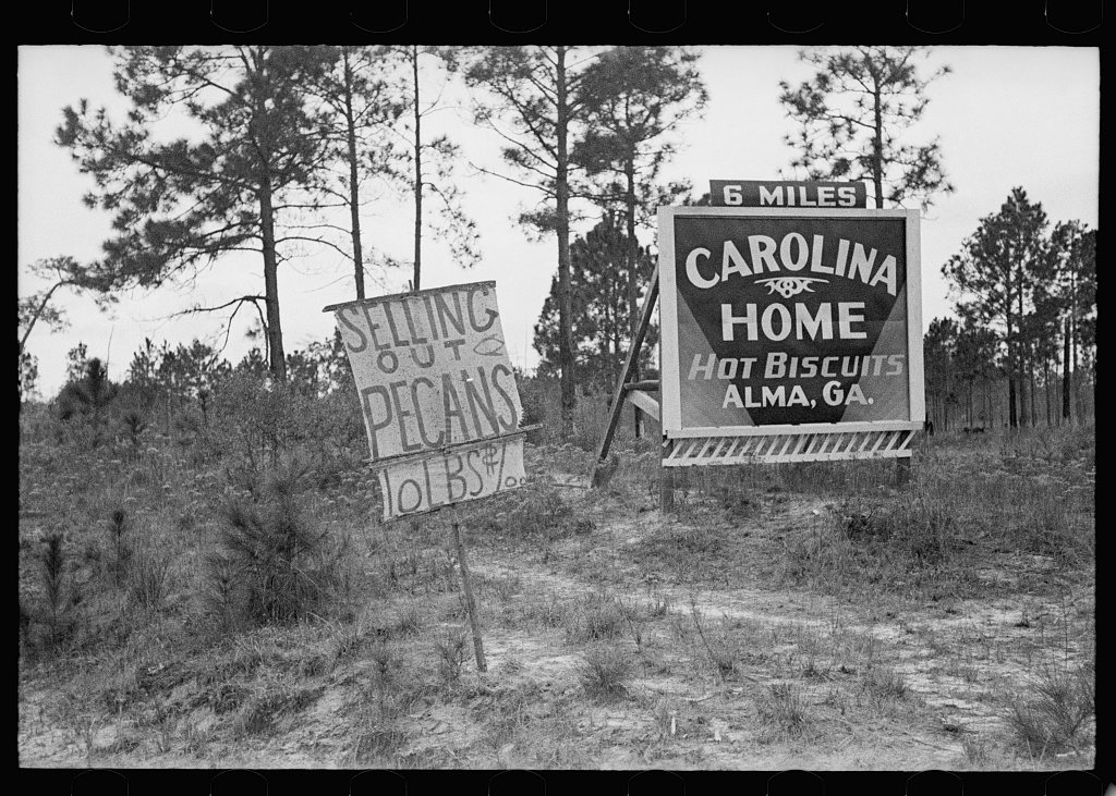 Road sign near pecan stand