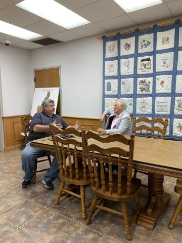Jerry Carl speaking with a constituent in Grove Hill - 2021