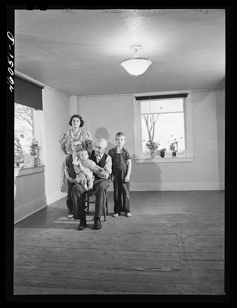 Mrs. Melvin Rivers, some of her children and her father-in-law in their new New York relocation corporation farm to whi…