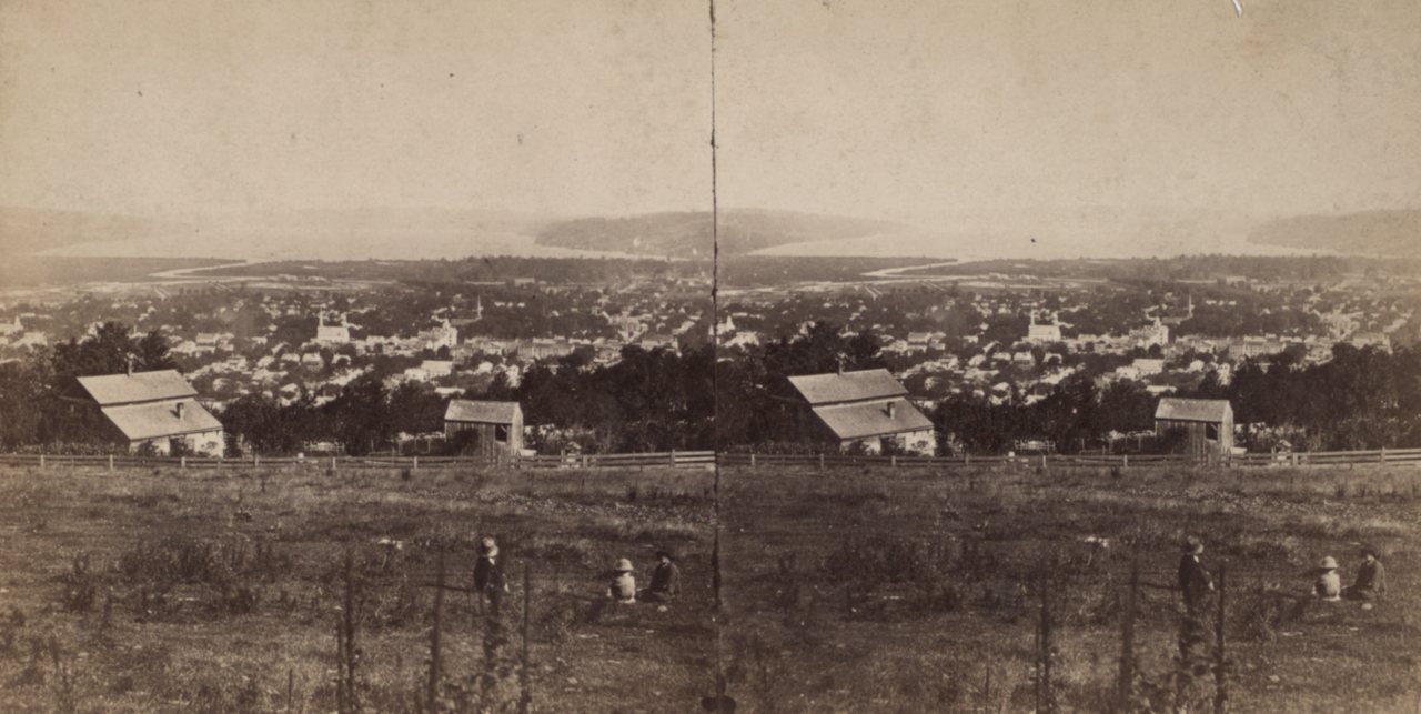 General view of Ithaca, Cayuga Lake in the distance