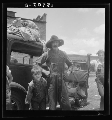 Douglas, Georgia. South Georgia tobacco sharecropper in town for auction. Note tobacco sheets in which he brought tobac…