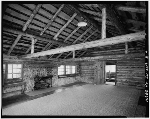 Cabin 2, interior view facing southwest showing fireplace and doorway to sleeping porch. - Peavy Cabins, Cabin 2, Block…