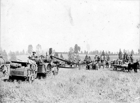 Farm workers with steam driven threshing machine, Troy, Idaho, ca. 1902