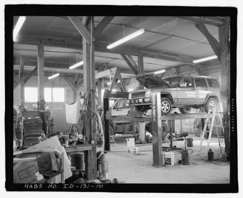 AFRD WAREHOUSE, INTERIOR, FACING SOUTHEAST TOWARD SOUTHEAST CORNER. SHEET ROCK ON CEILING. RAFTERS ARE SUPPORTED BY POS…