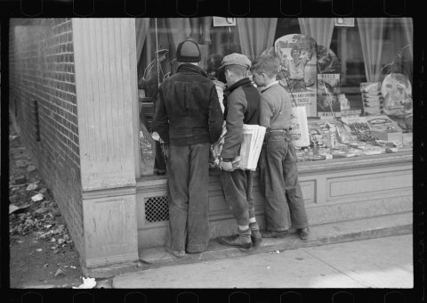Newsboys admiring sporting goods