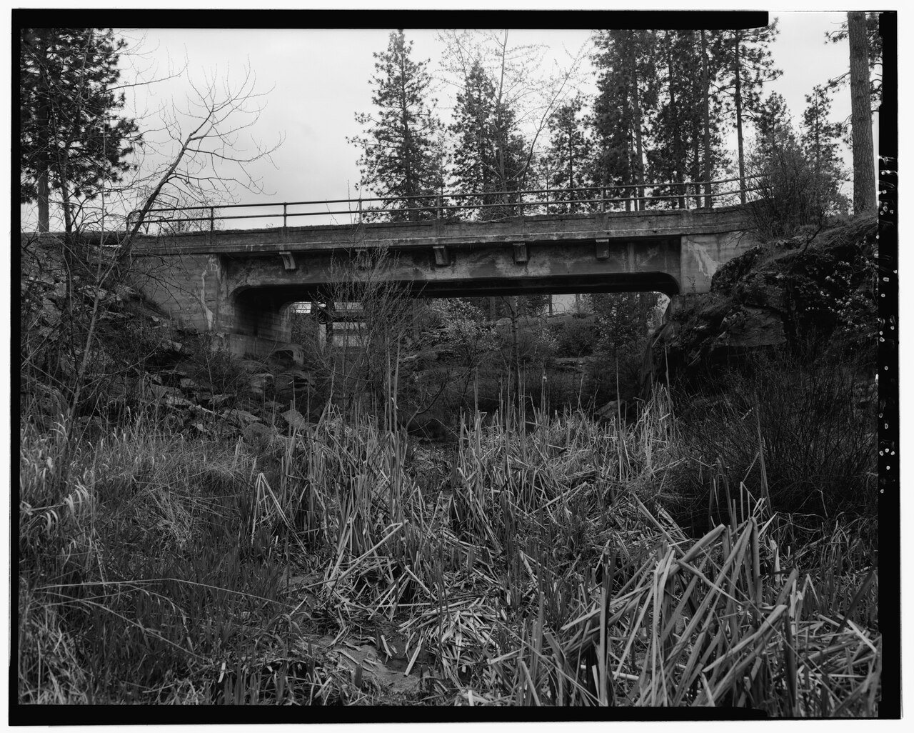 CONTEXTUAL VIEW OF THE IRRIGATION BRIDGE LOOKING SOUTHEASTERLY. - Washington Water Power Company Post Falls Power Plant…