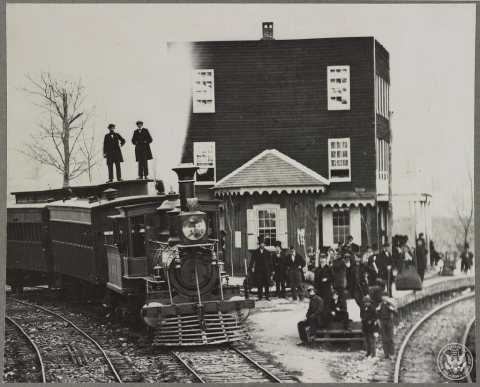 Hanover Junction Pennsylvania, 1863, railroad station. Detail of engine in yard and waiting crowd