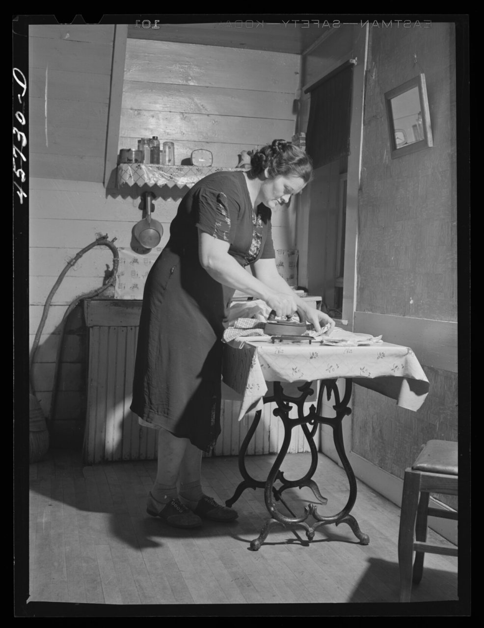 Mrs. Gaynor doing her ironing on their farm