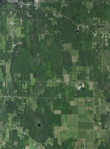 Aerial view of Juddville, Thorp Pond, southern Fish Creek, and south tip of Peninsula State Park in the town of Gibralt…