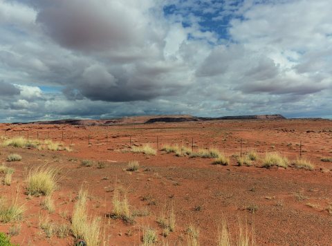 Stormclouds over the desert near the tiny and remote settlement of Teec Nos Pos, Navajo for "Cottonwoods in a Circle", …
