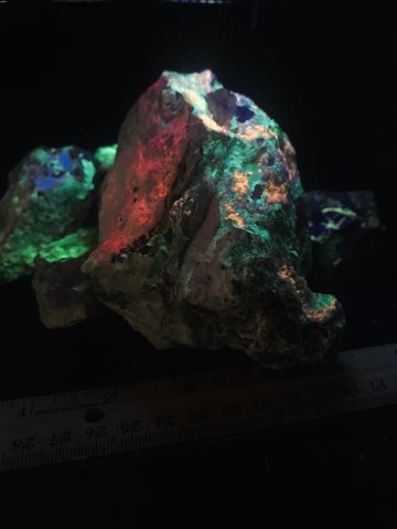 Group of Rocks under Shortwave UV from a Mine Dump Near