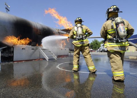 US Navy 100512-N-0775Y-011 Kings County fire fighters battle a fire on a training simulator during Operation Parkview