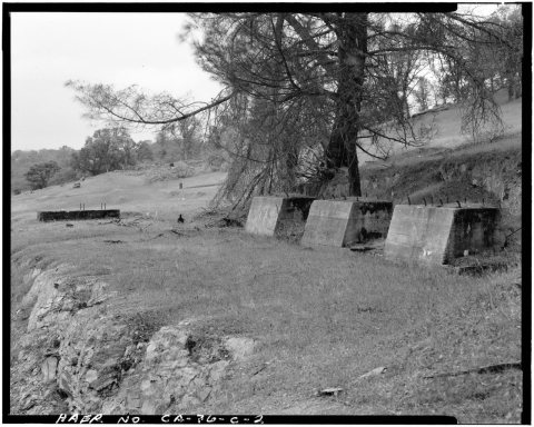VIEW, LOOKING FROM THE NORTHEAST. THESE THREE CONCRETE MORTAR BLOCKS WERE FOR THE MILL'S 3-STAMP BATTERIES ERECTED IN 1…