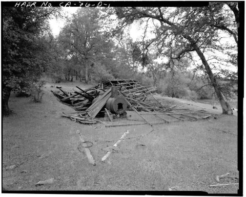 VIEW, LOOKING FROM THE SOUTHEAST, OF THE DEFIANCE MILL. THE STEAM BOILER AND VANNER ARE UNDER THE COLLAPSED TIMBERS OF …