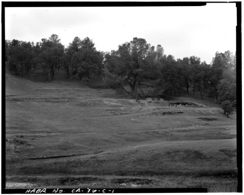 VIEW OF THE WILBUR-WOMBLE MILL SITE, LOOKING NORTHEAST FROM LITTLE JOHNS CREEK. THE THREE CONCRETE MORTAR BLOCKS MARK T…