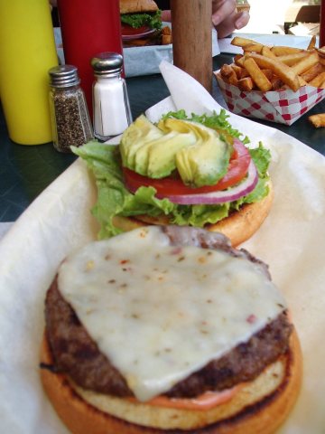 Cheeseburger, fries, toppings and condiments