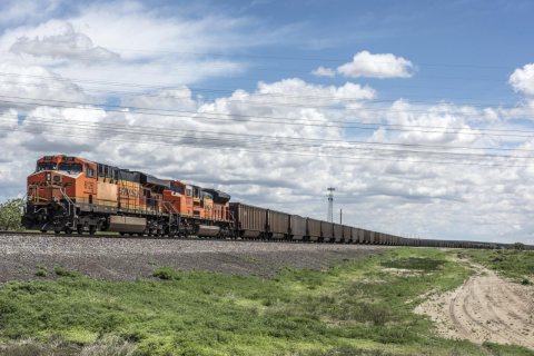 A long, passing freight train near Avondale in rural Pueblo County, Colorado