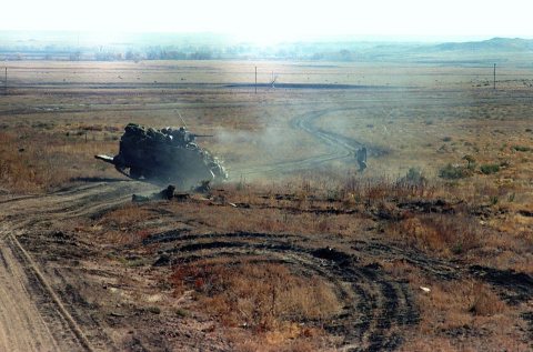 An M-113 armored personnel carrier on maneuvers during a downrange training exercise
