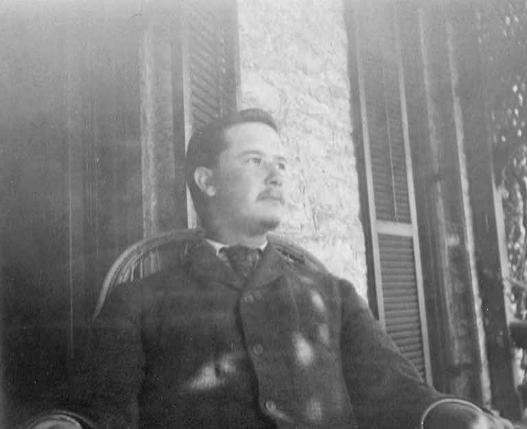 Edgar Ames sitting on a porch at Notchcliff, Elsah (Ill.), ca. 1890s