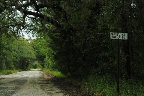 CR13nRoad-TravelAtOwnRiskSign