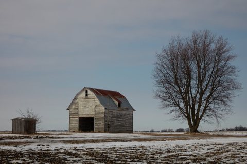 Winter accentuates the bleakness of this abandoned barn scene near Creston, Illinois