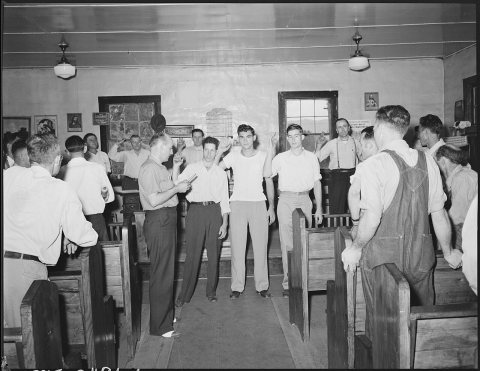 G.W. Hall, district field worker UMWA gives oath to miners joining union. Black Mountain Corporation, 30-31, Kenvir... …