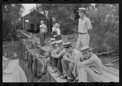 Residents at Boothville, Louisiana sitting on dock