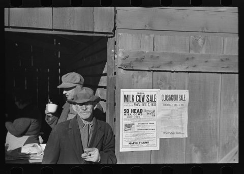 Farmers in front of lunch shed, country auction