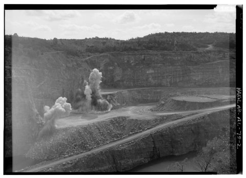 EXTERIOR VIEW, LOOKING NORTH, OF THE 'OLD PIT' WITH EXTRACTION OF LIMESTONE IN PROCESS. AN ELEVEN-HOLE SHOT IS DISLODGI…