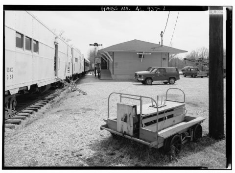 OVERVIEW, LOOKING EAST OF SIDE ELEVATION OF THE DEPOT (RIGHT) WHICH SERVES AS THE HEART OF DIXIE RAILROAD MUSEUM. AT LE…