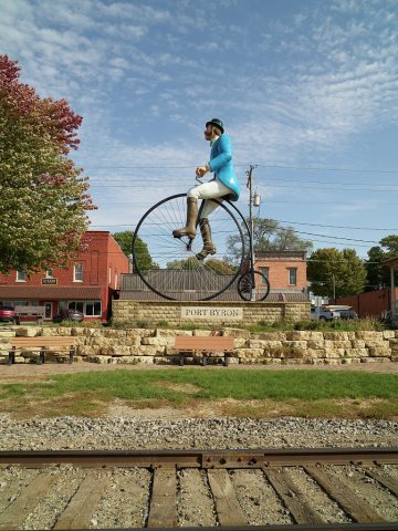 Figure of a man on a "high wheeler" bicycle