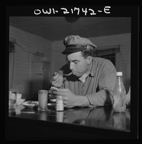 Pearlington (vicinity), Mississippi. Truck driver eating at a trucker's stop along U.S. Highway 90