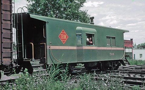 Toledo, Peoria and Western Caboose 504 at IC Crossing at Gilman, IL on July 22, 1962