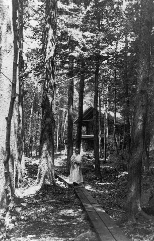 Marian MacDowell in the woods near the log cabin studio
