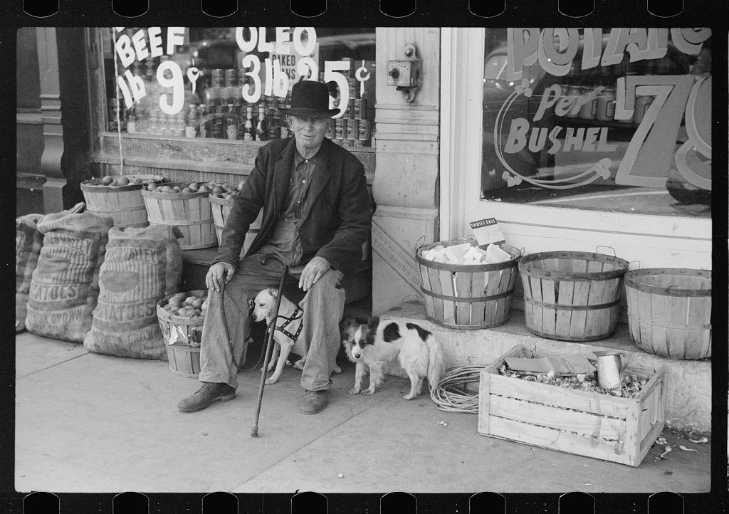 Man and dogs in front of grocery store