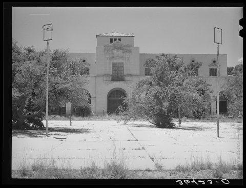 One of the main buildings with town square in foreground of the Burro Mountain Copper Company, now inactive, at Tyrone,…