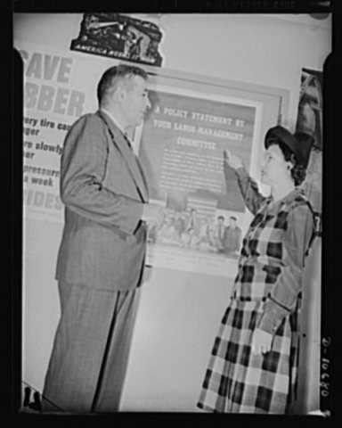Left to right: Michael W. Straus, Chief, War Production Drive Headquarters, and Mrs. Marie McPherson, Chairman, Labor M…