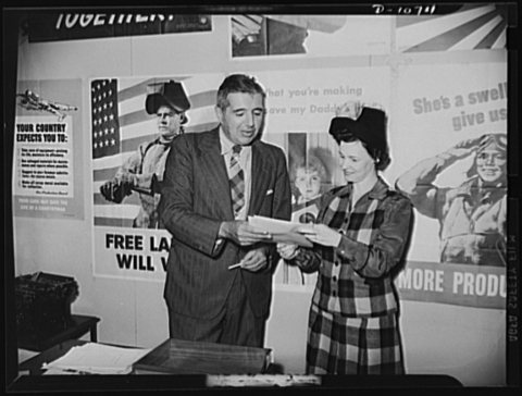 Left to right: Michael W. Straus, Chief, War Production Drive Headquarters, and Mrs. Marie McPherson, Chairman, Labor-M…