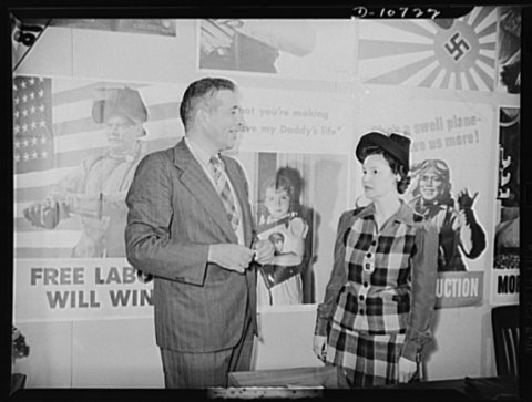 Left to right: Michael W. Straus, Chief of War Production Drive Headquarters; Mrs. Marie McPherson, Chairman, Labor-Man…