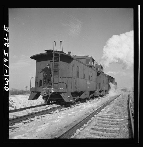 Chillicothe, Illinois. Changing crews and cabooses of a westbound freight train along the Atchison, Topeka and Santa Fe…