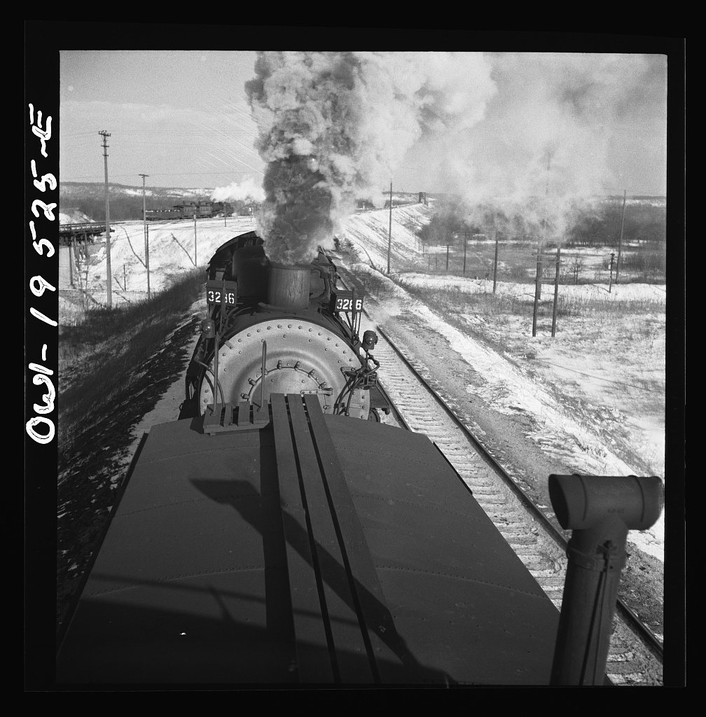 Chillicothe, Illinois. A helper engine is taken on for added power on a grade extending eight miles on the Atchison, To…